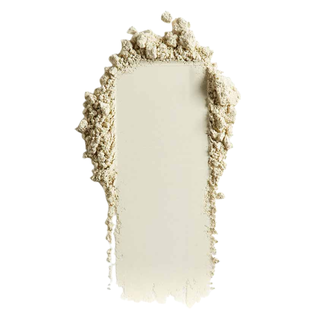 Monipuolinen vihreän sävyinen Lily Lolo Mineraalikorjausväri sävyssä Blush Away taittaa punaisuutta iholta.